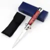 Italian Stiletto Switchblade Red Pearl Resin Button 1.1.webp